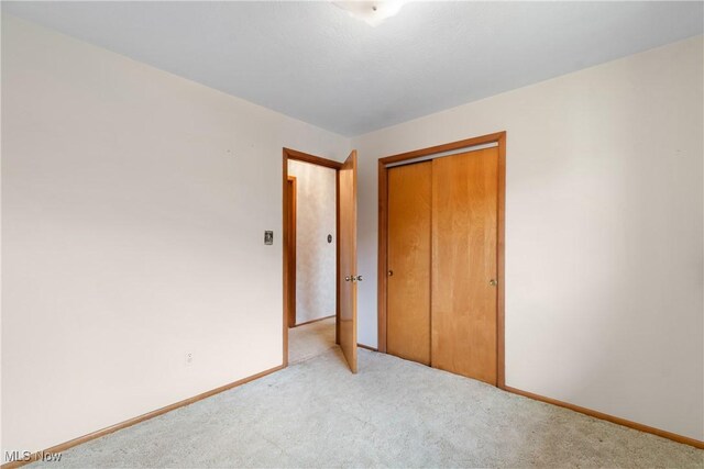 4899 Autumn Ln, Brooklyn, OH 44144 - unfurnished bedroom with carpet flooring and a closet