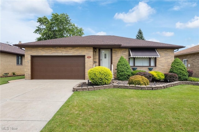 4899 Autumn Ln, Brooklyn, OH 44144 - view of front of house with brick siding, an attached garage, a front lawn, concrete driveway, and a shingled roof