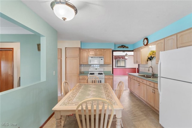 4899 Autumn Ln, Brooklyn, OH 44144 - kitchen with white appliances, light brown cabinets, and tasteful backsplash