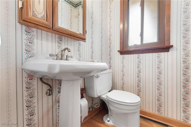 4899 Autumn Ln, Brooklyn, OH 44144 - half bathroom featuring wood finished floors