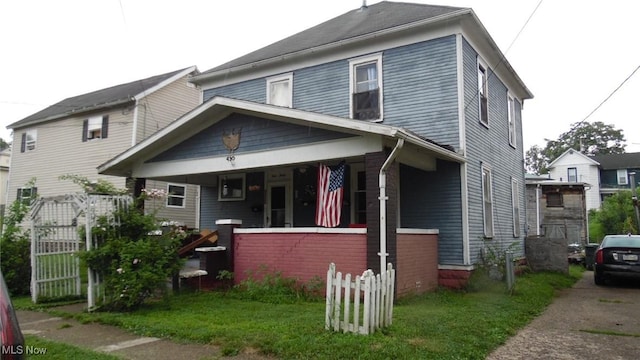 430 S 3rd St, Coshocton, OH 43812 - view of front facade with a porch and a front yard