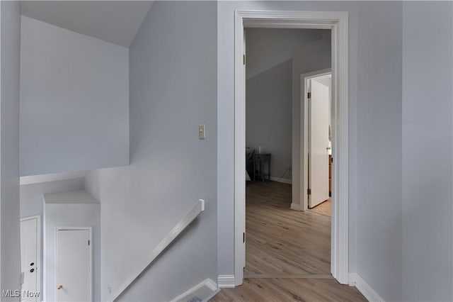 1173 Red Tail Hawk Ct Unit 4, Youngstown, OH 44512 - hallway with an upstairs landing and light wood-style floors