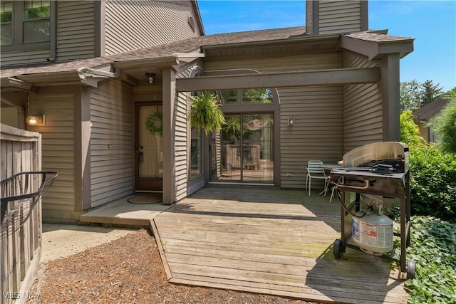 1173 Red Tail Hawk Ct Unit 4, Youngstown, OH 44512 - doorway to property featuring a wooden deck, a shingled roof, and a chimney