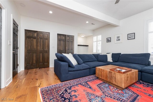 1906 W 47th St, Cleveland, OH 44102 - living area featuring light wood-type flooring, beam ceiling, and recessed lighting
