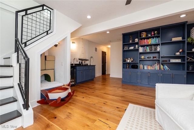 1906 W 47th St, Cleveland, OH 44102 - living area with stairs, light wood-style floors, recessed lighting, and wine cooler