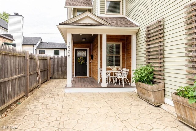 1906 W 47th St, Cleveland, OH 44102 - entrance to property featuring a porch and roof with shingles