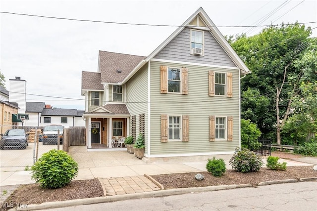 1906 W 47th St, Cleveland, OH 44102 - view of front of home featuring a gate, cooling unit, and a shingled roof