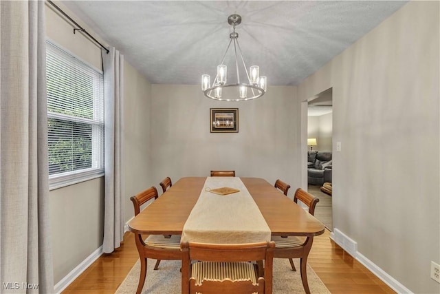 4090 Ridgeview Rd, Cleveland, OH 44144 - dining area with a chandelier and light wood-style floors