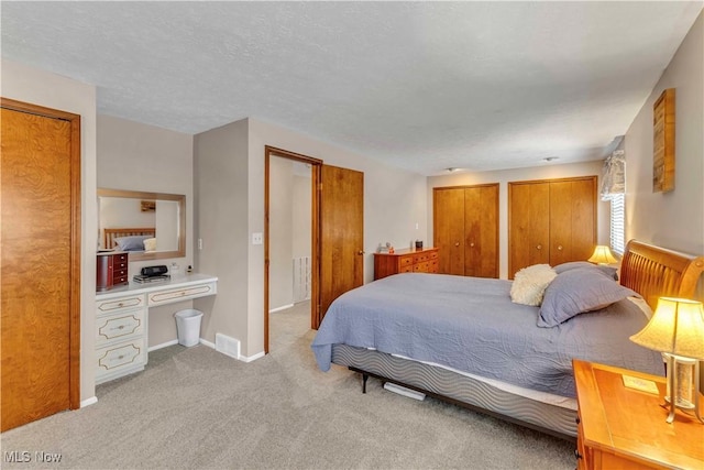 4090 Ridgeview Rd, Cleveland, OH 44144 - bedroom featuring two closets and carpet floors