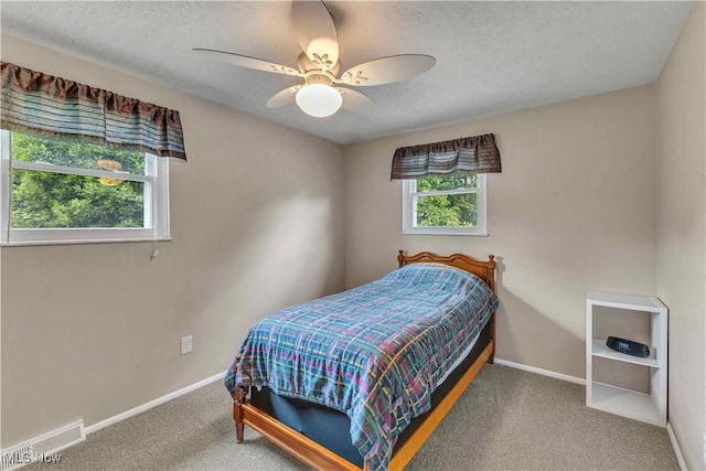 4090 Ridgeview Rd, Cleveland, OH 44144 - carpeted bedroom with a textured ceiling and a ceiling fan