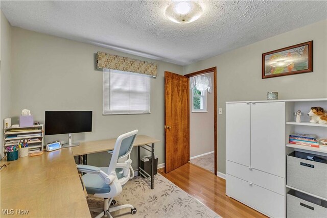 4090 Ridgeview Rd, Cleveland, OH 44144 - office area with wood finished floors and a textured ceiling