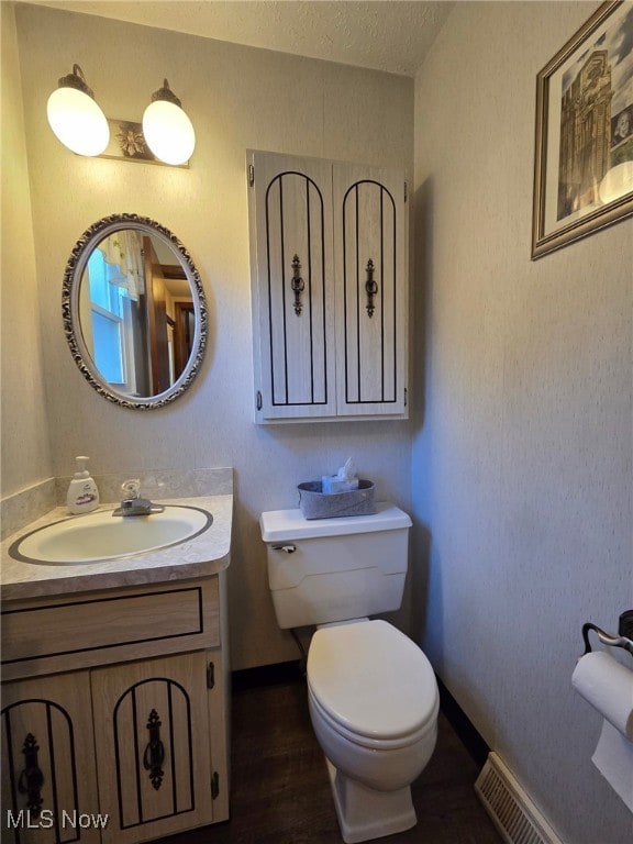 4090 Ridgeview Rd, Cleveland, OH 44144 - half bathroom with vanity and wood finished floors