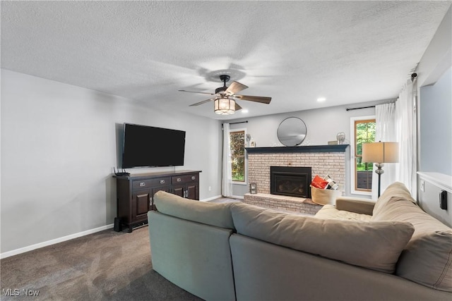 3049 Deercrest Path, Stow, OH 44224 - carpeted living area with a ceiling fan, healthy amount of natural light, a brick fireplace, and a textured ceiling