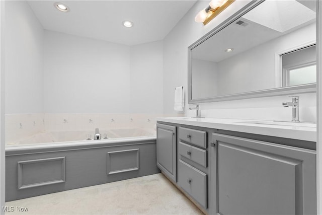 3049 Deercrest Path, Stow, OH 44224 - bathroom featuring double vanity, a garden tub, and recessed lighting