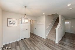 105 Vesper Cir, Lodi, OH 44254 - foyer with wood finished floors, stairs, a chandelier, and recessed lighting