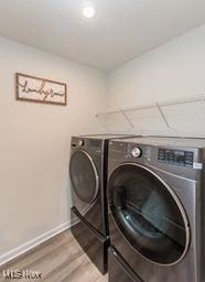 105 Vesper Cir, Lodi, OH 44254 - laundry area with washing machine and dryer, wood finished floors, and recessed lighting