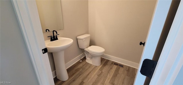 9125 Ledge View Ter, Broadview Heights, OH 44147 - half bathroom featuring toilet and wood finished floors