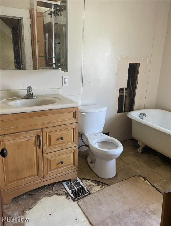 501 W 21st St, Lorain, OH 44052 - bathroom with a soaking tub, vanity, and tile patterned flooring