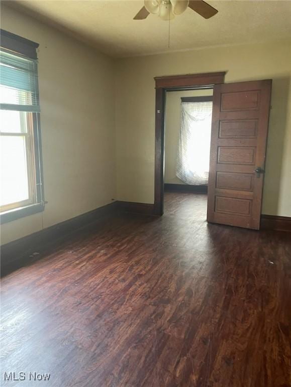 501 W 21st St, Lorain, OH 44052 - unfurnished room featuring ceiling fan and dark wood-style flooring