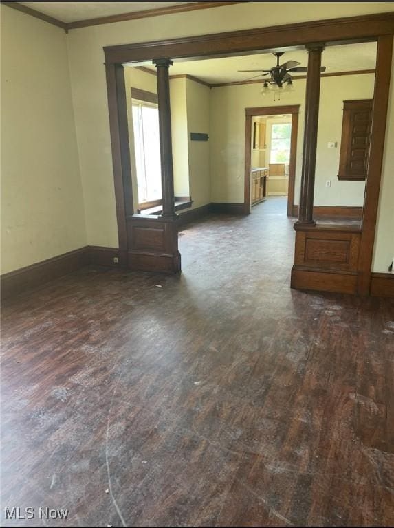 501 W 21st St, Lorain, OH 44052 - empty room featuring crown molding, wood finished floors, ornate columns, and ceiling fan