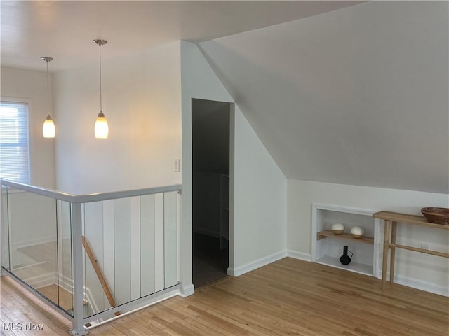 6704 Northcliff Ave, Brooklyn, OH 44144 - additional living space featuring wood finished floors, built in features, and lofted ceiling