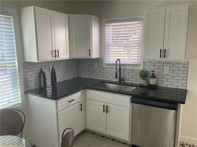6704 Northcliff Ave, Brooklyn, OH 44144 - kitchen featuring stainless steel dishwasher, white cabinetry, and backsplash