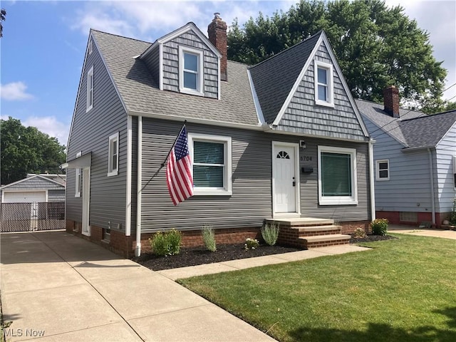 6704 Northcliff Ave, Brooklyn, OH 44144 - view of front of house with a front lawn, roof with shingles, an outdoor structure, a chimney, and a garage