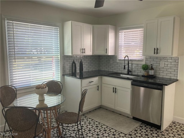 6704 Northcliff Ave, Brooklyn, OH 44144 - kitchen featuring stainless steel dishwasher, light floors, white cabinetry, and decorative backsplash