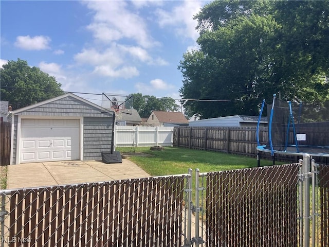 6704 Northcliff Ave, Brooklyn, OH 44144 - fenced backyard featuring a gate, a trampoline, a detached garage, and an outbuilding