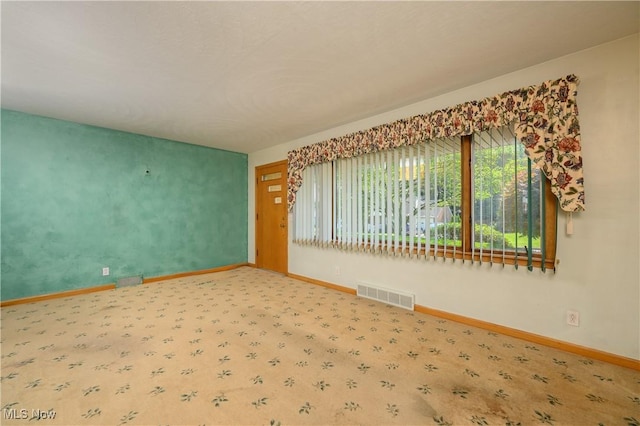 731 Hemlock St NW, Massillon, OH 44647 - unfurnished room featuring baseboards and carpet floors