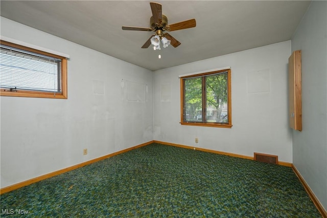 731 Hemlock St NW, Massillon, OH 44647 - carpeted spare room featuring baseboards and ceiling fan