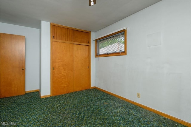 731 Hemlock St NW, Massillon, OH 44647 - unfurnished bedroom featuring a closet and carpet floors