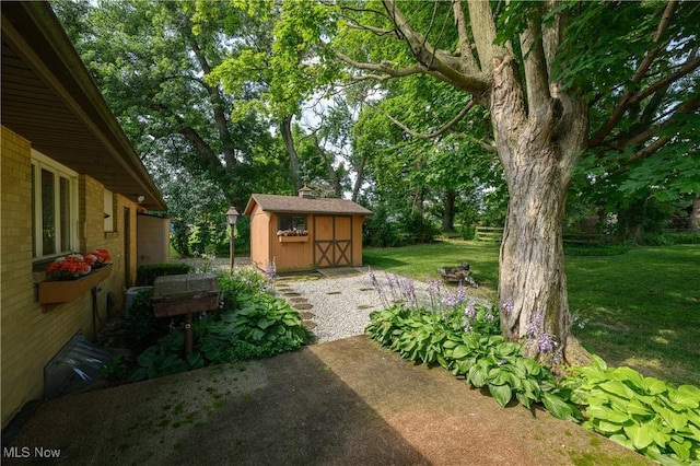 731 Hemlock St NW, Massillon, OH 44647 - view of green lawn featuring a shed