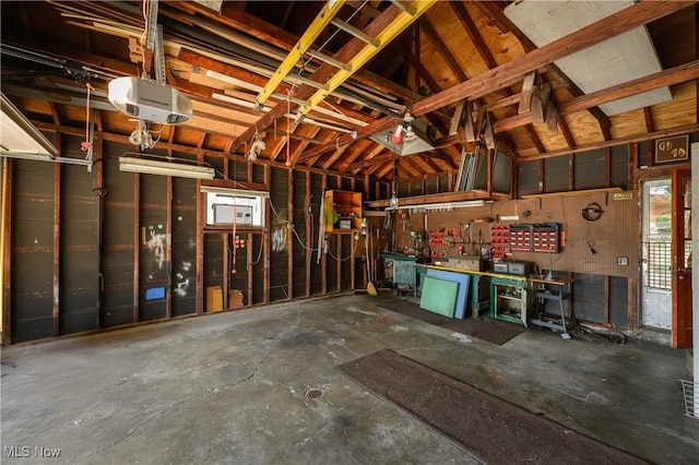 731 Hemlock St NW, Massillon, OH 44647 - garage with a workshop area and a garage door opener
