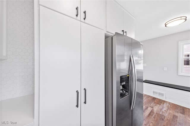 3763 Orchard St, Mogadore, OH 44260 - kitchen featuring stainless steel refrigerator with ice dispenser, white cabinetry, and wood finished floors