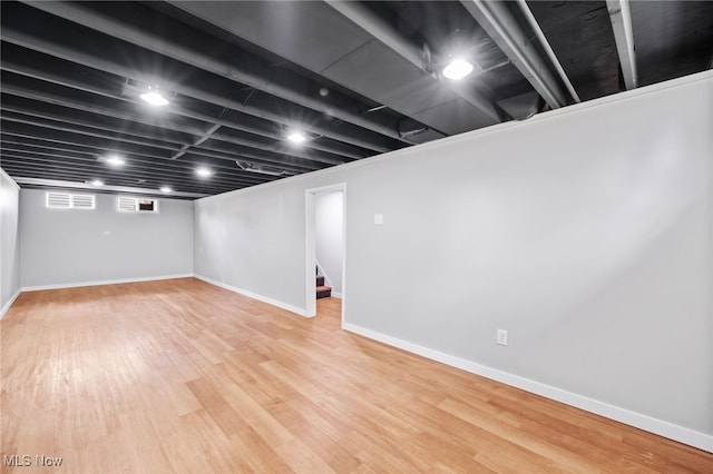 3763 Orchard St, Mogadore, OH 44260 - basement featuring wood finished floors and stairs
