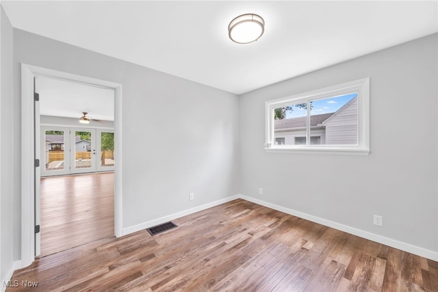 3763 Orchard St, Mogadore, OH 44260 - unfurnished room with wood finished floors and french doors