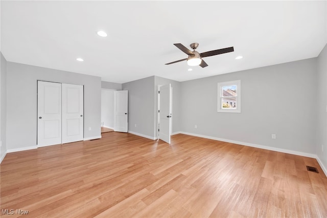 3763 Orchard St, Mogadore, OH 44260 - unfurnished bedroom with light wood-style flooring, a closet, recessed lighting, and a ceiling fan