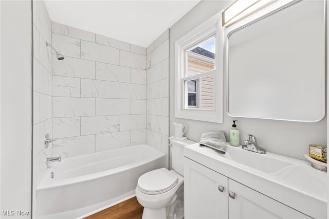 3763 Orchard St, Mogadore, OH 44260 - bathroom featuring vanity,  shower combination, and wood finished floors