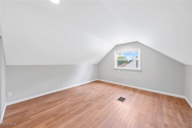 3763 Orchard St, Mogadore, OH 44260 - additional living space featuring light wood-type flooring and vaulted ceiling