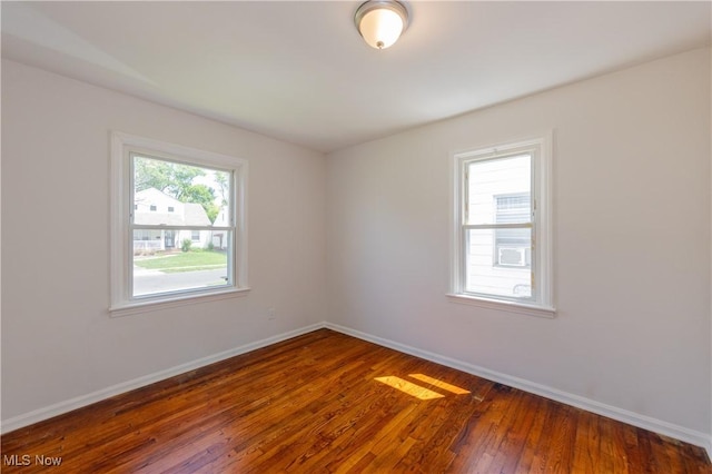 21304 Watson Rd, Maple Heights, OH 44137 - empty room featuring baseboards and dark wood-style floors