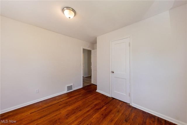 21304 Watson Rd, Maple Heights, OH 44137 - unfurnished room with wood finished floors and baseboards