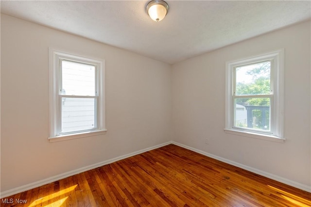 21304 Watson Rd, Maple Heights, OH 44137 - spare room featuring baseboards and hardwood / wood-style floors