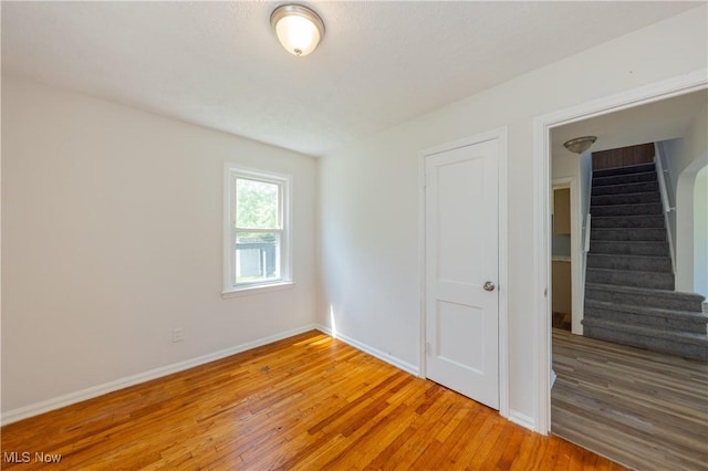 21304 Watson Rd, Maple Heights, OH 44137 - empty room featuring light wood-type flooring and stairway