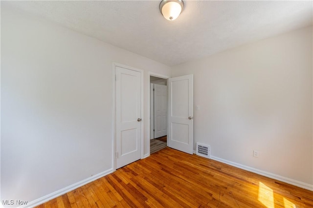 21304 Watson Rd, Maple Heights, OH 44137 - unfurnished room with baseboards and light wood-type flooring