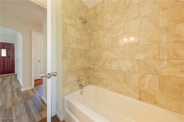 21304 Watson Rd, Maple Heights, OH 44137 - bathroom featuring wood finished floors and bathtub / shower combination
