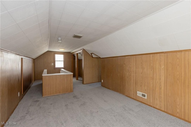 21304 Watson Rd, Maple Heights, OH 44137 - bonus room with light colored carpet, wood walls, and vaulted ceiling
