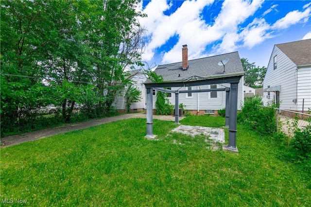 21304 Watson Rd, Maple Heights, OH 44137 - back of house featuring a chimney