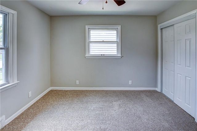 16005 Mendota Ave, Maple Heights, OH 44137 - unfurnished bedroom with carpet floors, a closet, and a ceiling fan