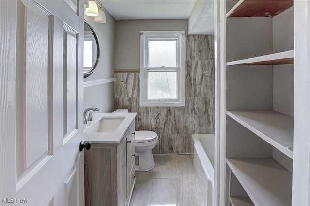 16005 Mendota Ave, Maple Heights, OH 44137 - bathroom featuring vanity and a tub to relax in